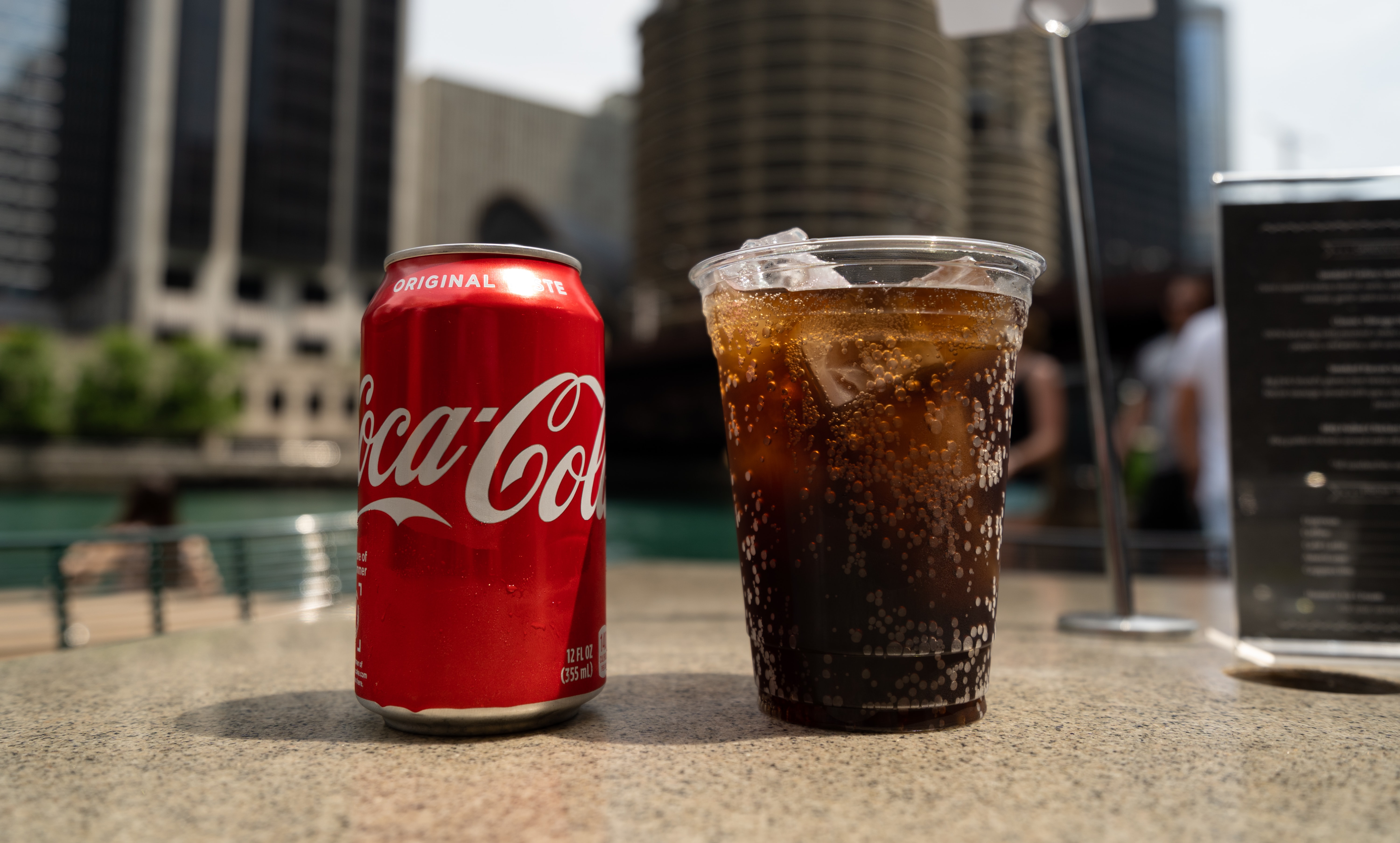 Coca-Cola in a glass with a can