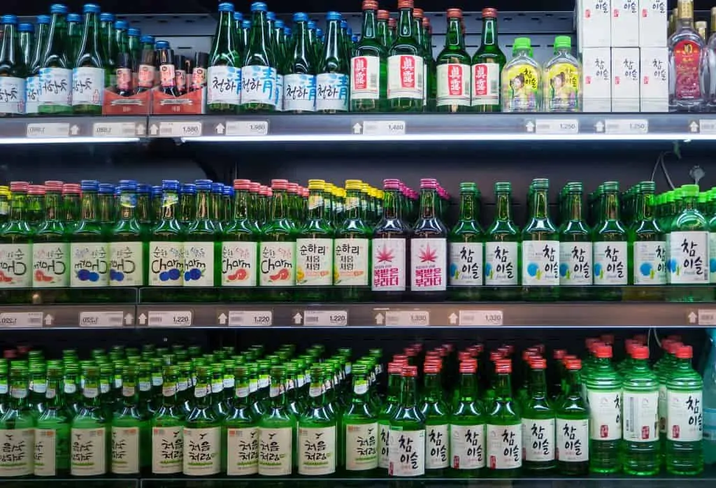 bottles of soju on a supermarket shelf