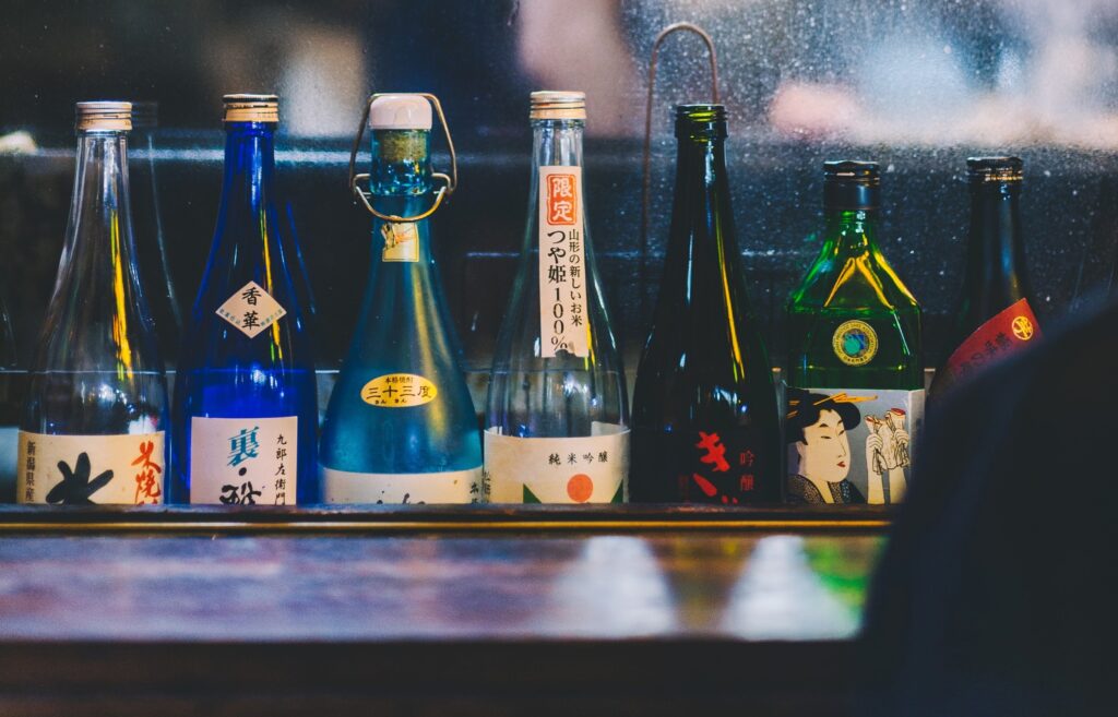 A row of soju bottles, all with different alcohol percentages, at a Korean bar