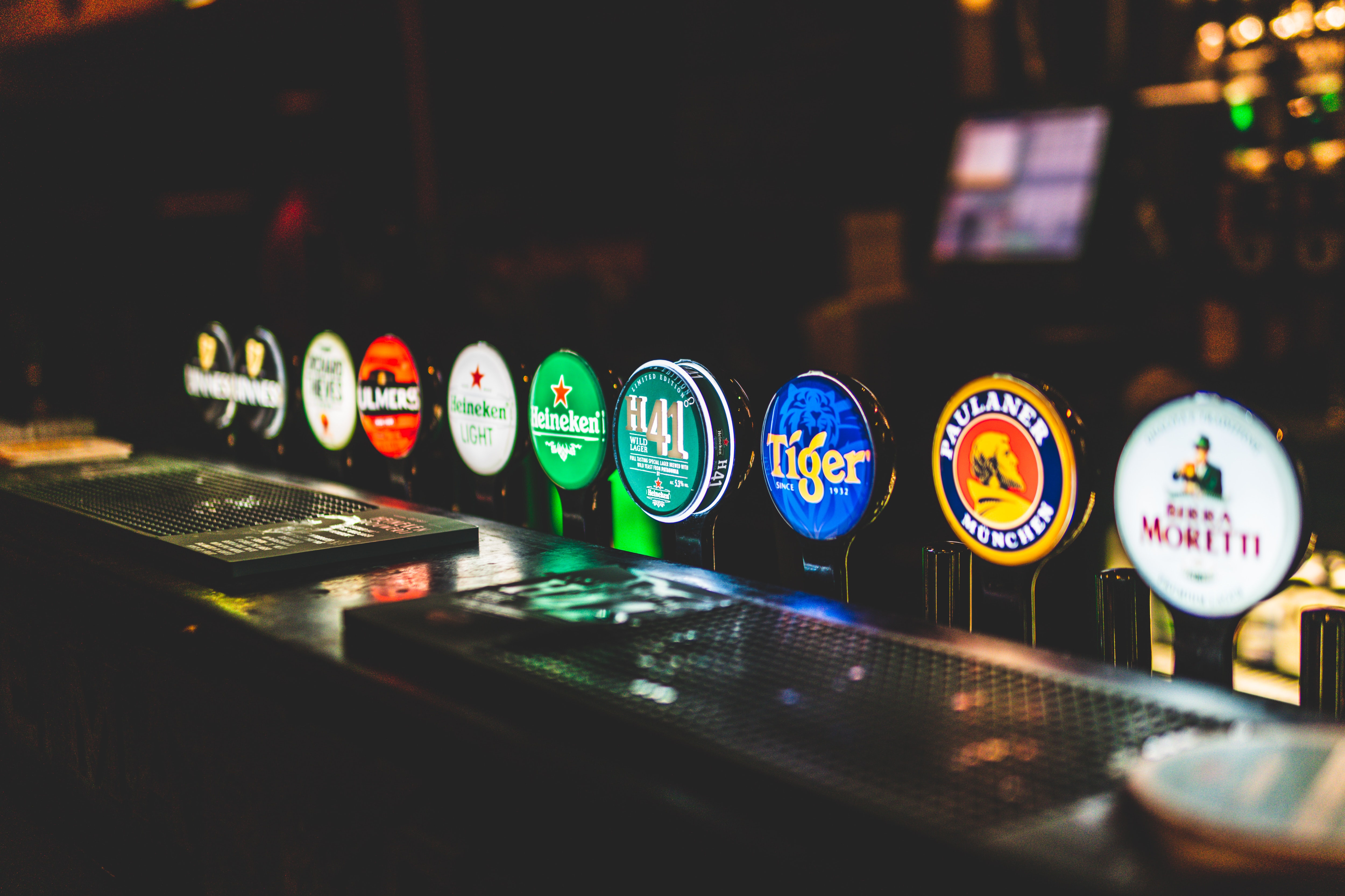a row of draft beer pumps