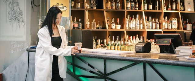 A bar in China with a woman ordering a drink